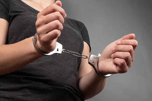 depositphotos_486481302-stock-photo-handcuffed-girl-detention-woman-crime