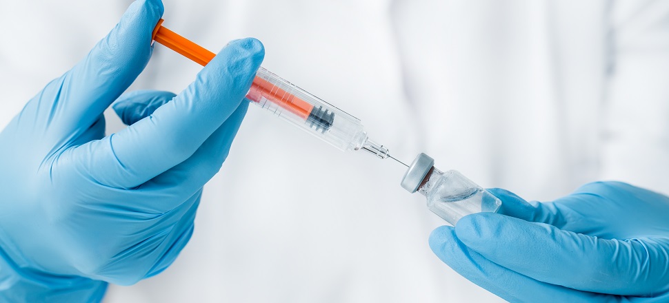 injection with gloved hands 970 x 440